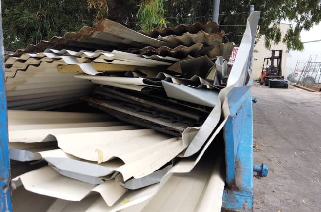 Scrap iron sheets for recycling.